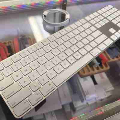 Apple Magic Keyboard with Touch ID and Numeric Keypad for Mac Models.